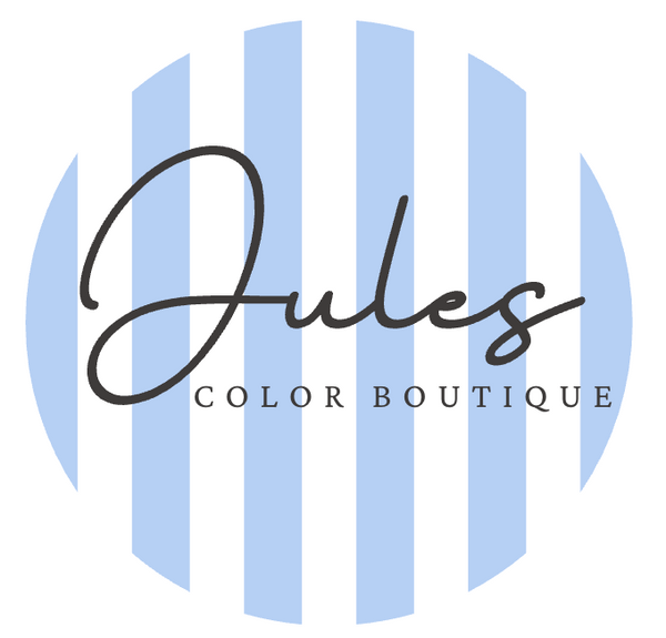 Logo of Jules Color Boutique with blue stripes and black text on a white background