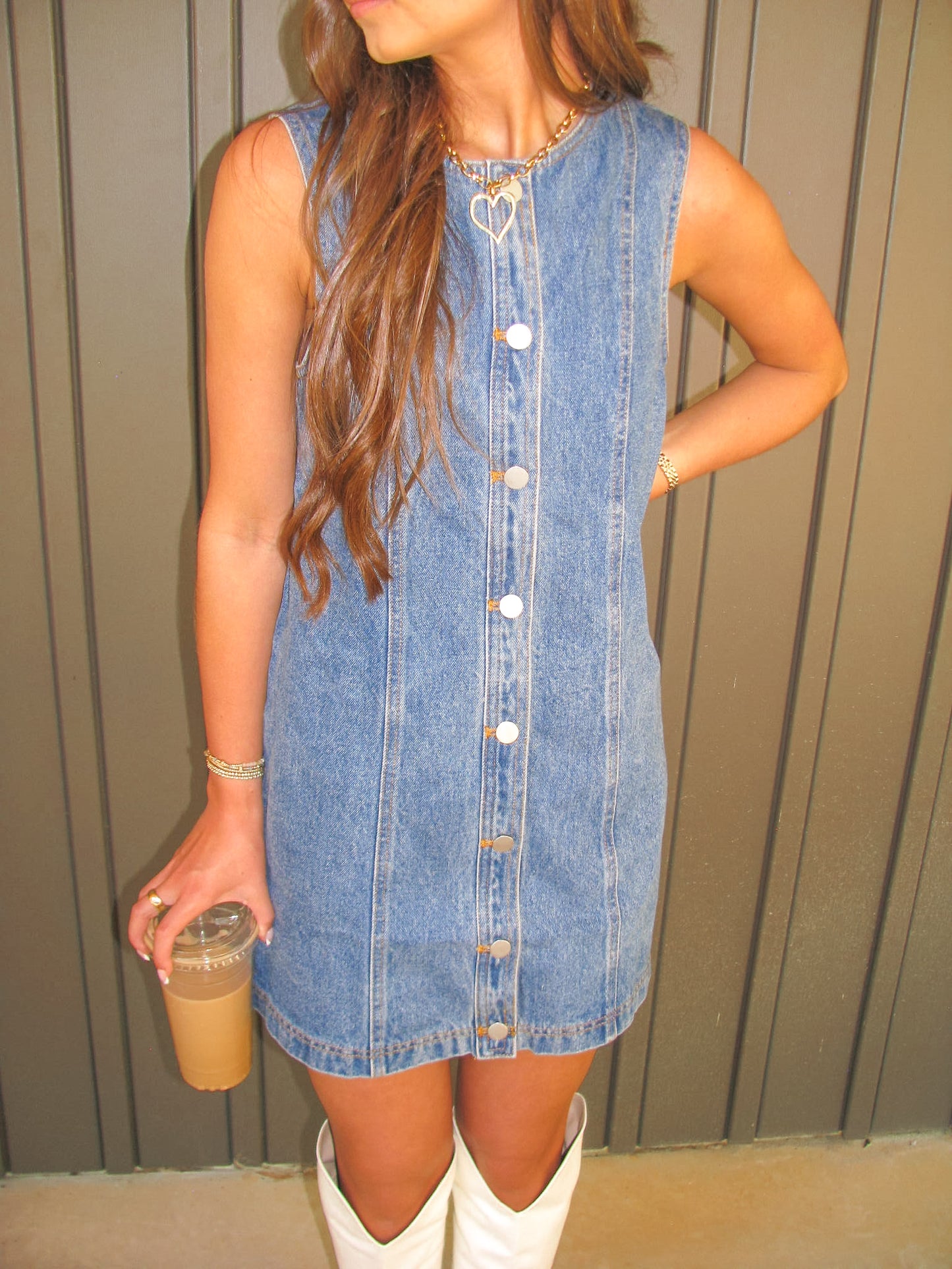 woman wearing button down denim dress