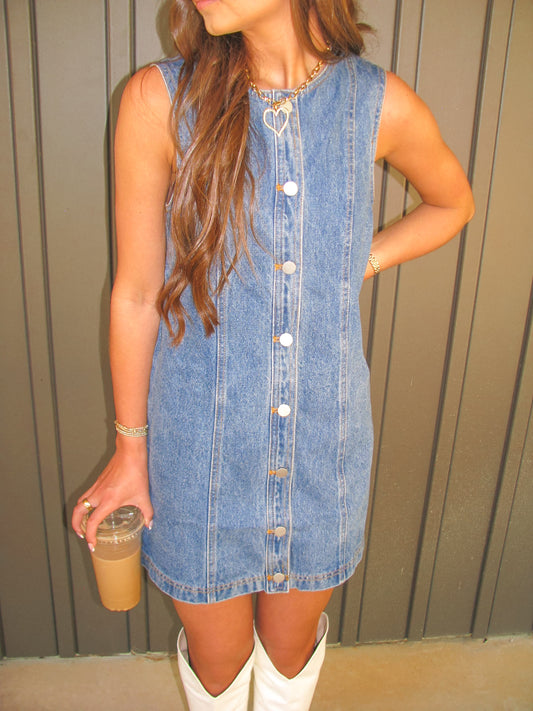 woman wearing button down denim dress