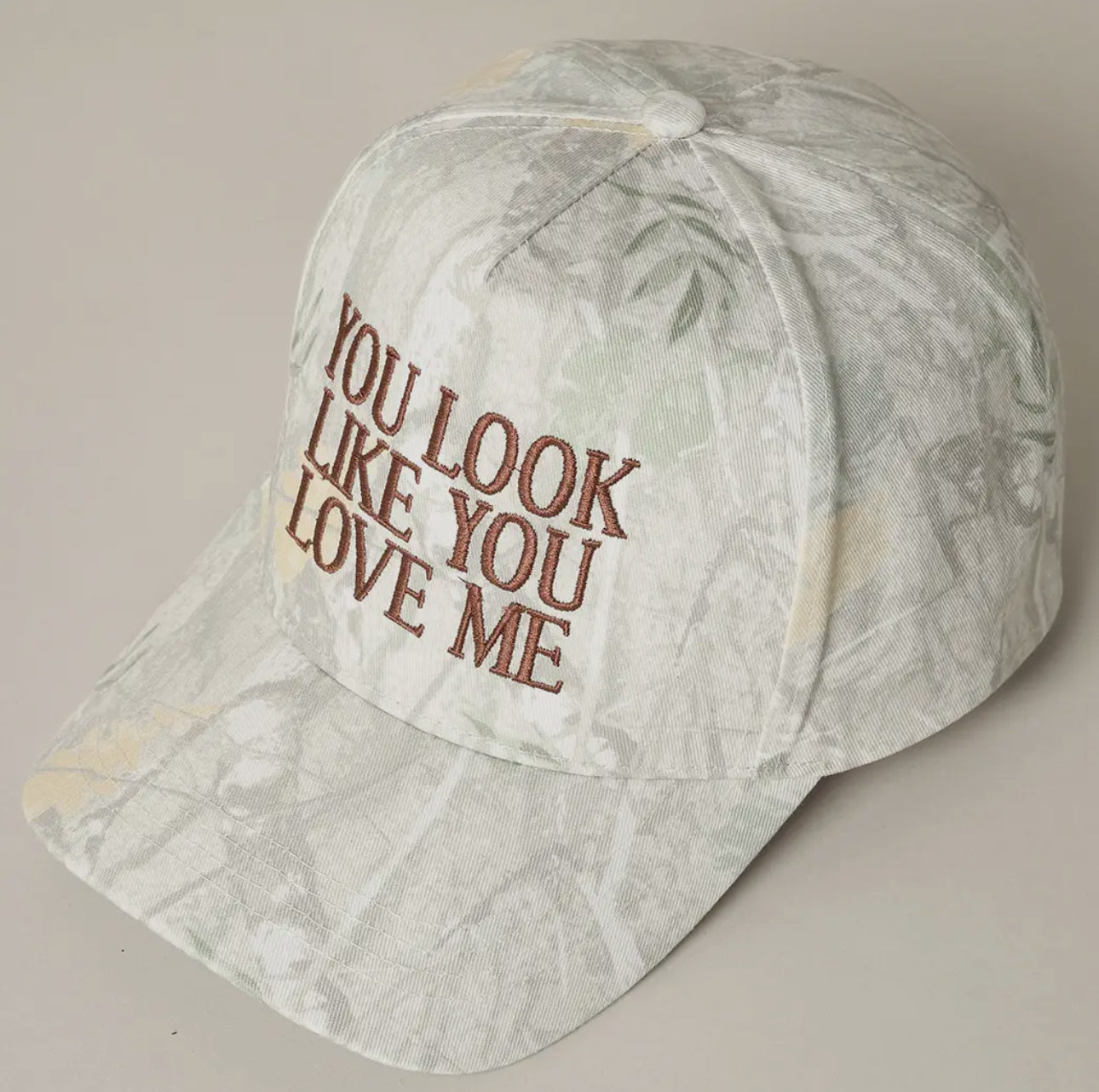 Trendy camo trucker hat with embroidered 'You Look Like ou Love Me' Design